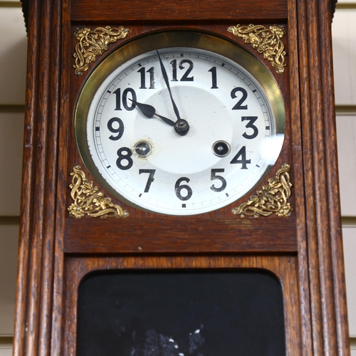 708 - A Vintage stained oak 8-day drop-dial wall clock, case height 55cm, with pendulum