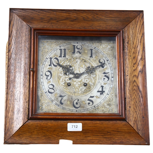 712 - A square oak-cased 2-train wall clock, with engraved dial, 37cm