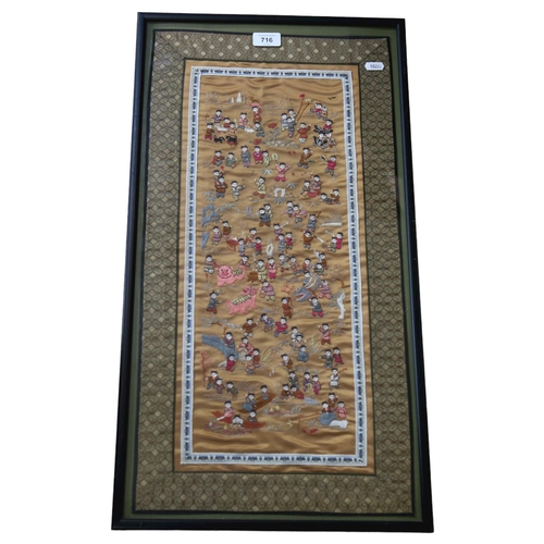 716 - A Chinese embroidered silk panel, depicting children at play, framed, height 69cm overall