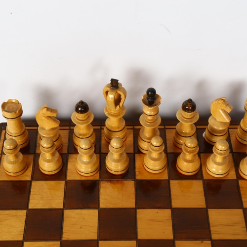 769 - A modern turned wood chess set, including board, King height 11cm