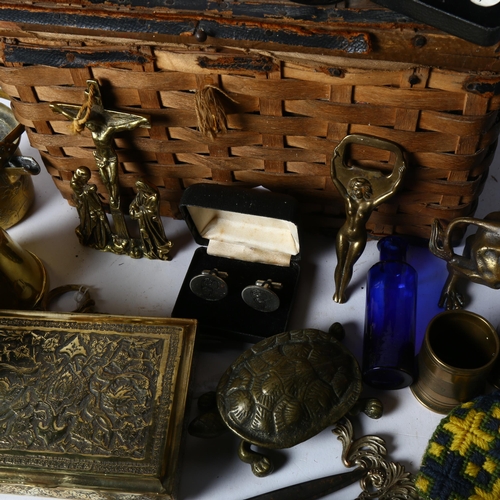 395 - A Vintage wicker basket containing various items, including a mini brass telescope, a brass lion fig... 