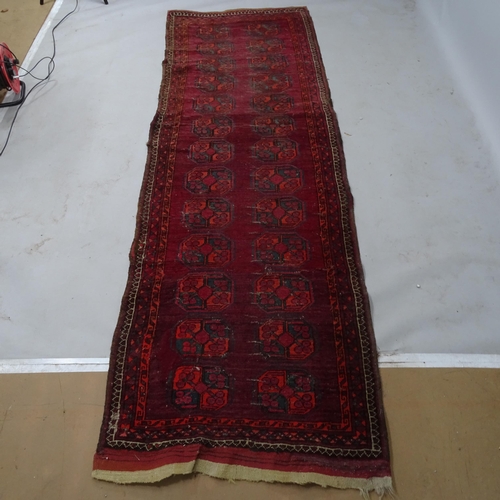 2332 - A red ground Turkish runner, 285 x 90cm