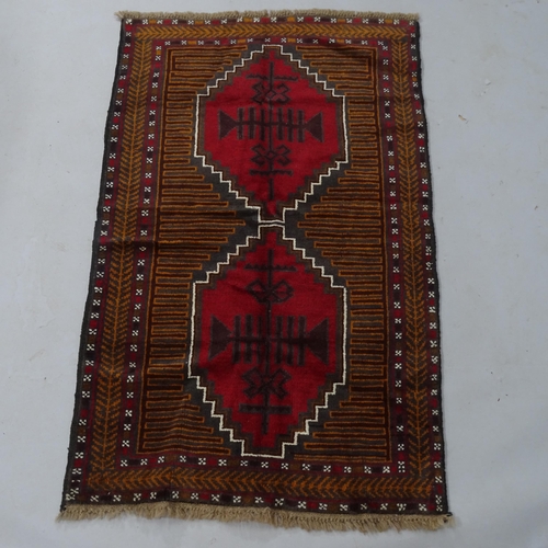 2336 - A red ground Beluchi rug, 143 x 88cm