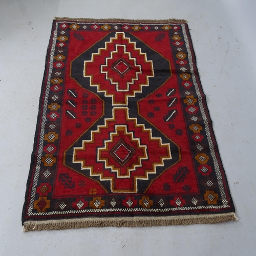 2304 - A red-ground Baluchi rug, 140cm x 92cm