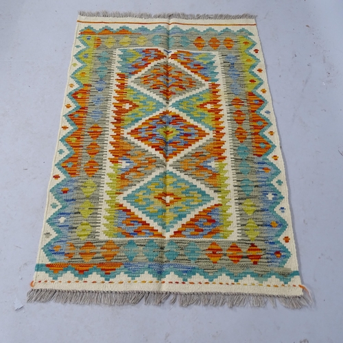 2308 - A Chobi Kilim rug. 113cm x 74cm