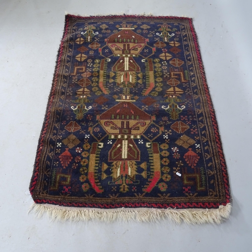 2314 - A blue-ground Afghan rug with asymmetric decoration. 145cm x 100cm