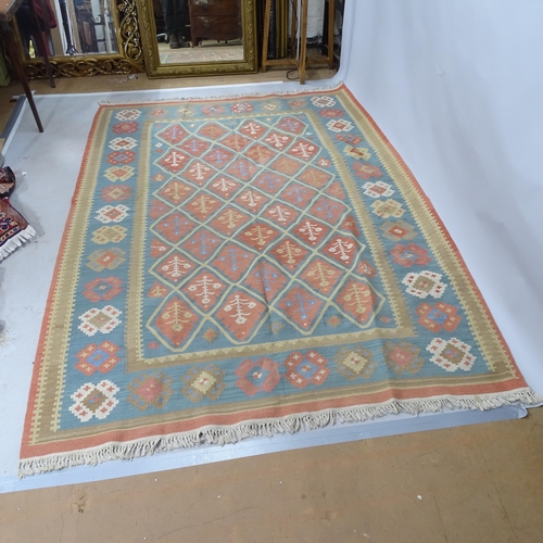 2317 - A blue and cream ground leaf design Kilim rug. 247cm x 170cm