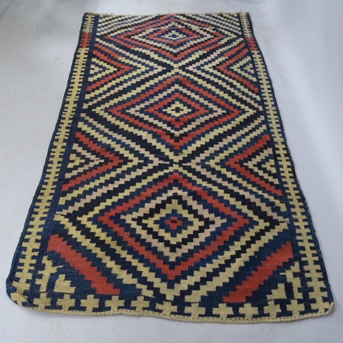 2321 - A South-American cream-ground Kilim rug. 215cm x 122cm