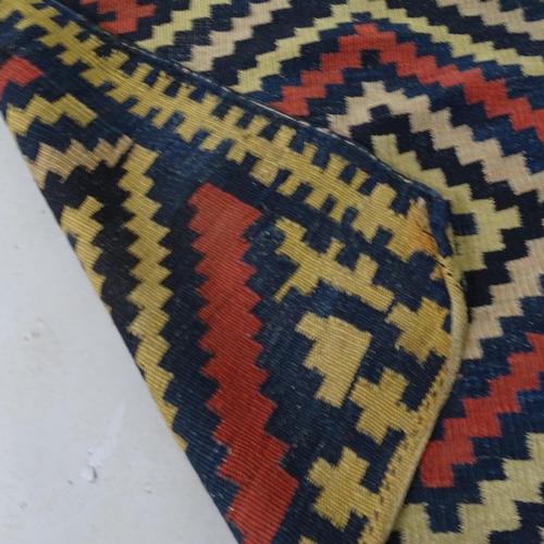 2321 - A South-American cream-ground Kilim rug. 215cm x 122cm