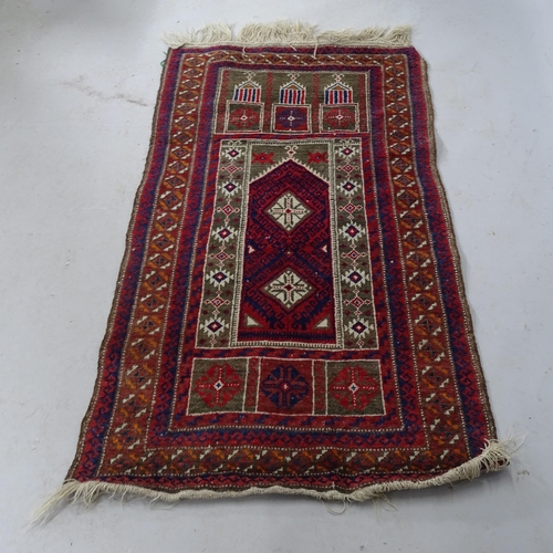 2325 - An Afghan red-ground prayer rug. 143cm x 78cm