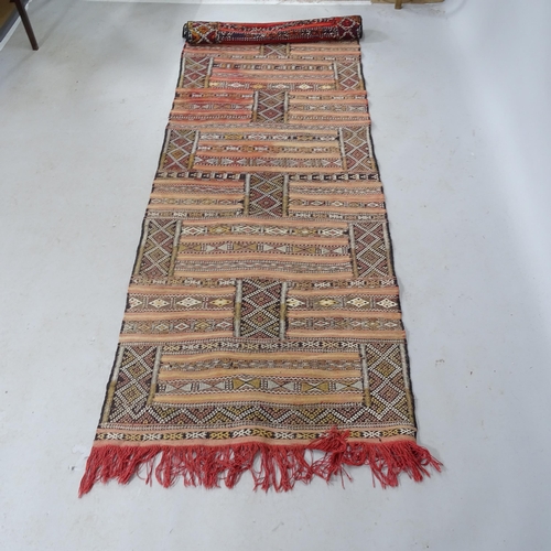 2326 - A Moroccan Kilim runner. 300cm x 80cm