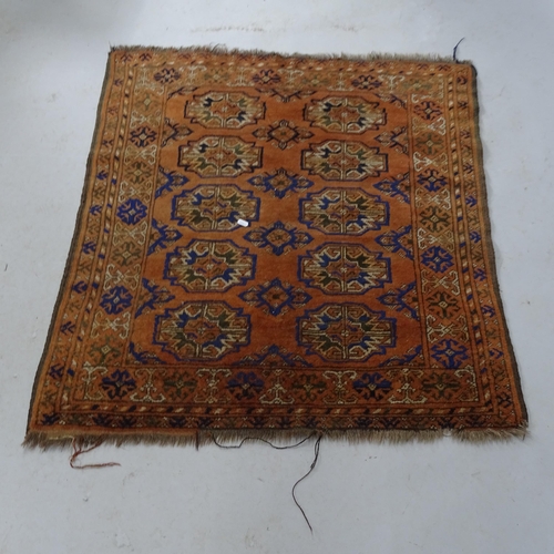 2328 - An orange ground Turkish mat. 110cm x 100cm