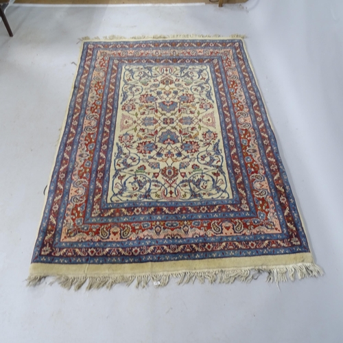 2330 - A 1930s blue-ground Tabriz rug with symmetrical border and pattern. 182cm x 122cm