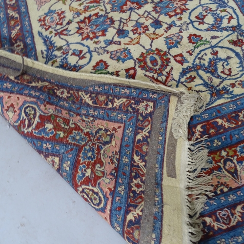 2330 - A 1930s blue-ground Tabriz rug with symmetrical border and pattern. 182cm x 122cm