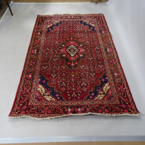 2331 - A red-ground Qashqai design rug. 200cm x 130cm