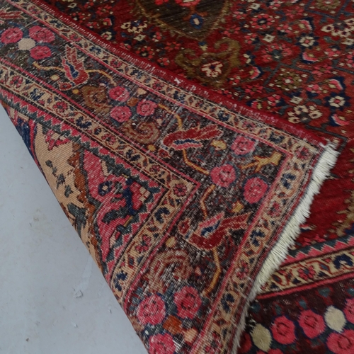 2331 - A red-ground Qashqai design rug. 200cm x 130cm