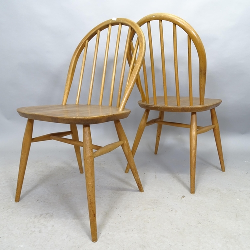 2641 - A pair of mid-century Ercol dining chairs, a coffee table of shaped form, a mirror 61cm x 106cm and ... 