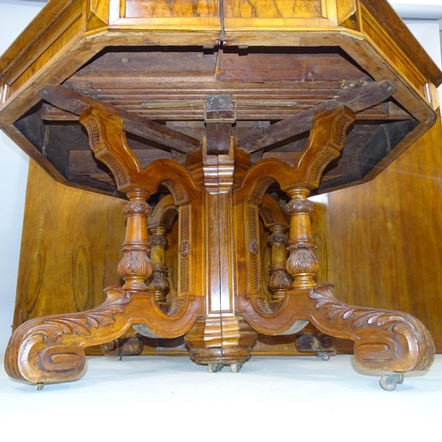 2642 - An antique mahogany octagonal draw leaf dining table with three spare leaves. 128cm (extending to 36... 