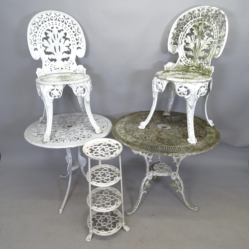 2652 - A painted cast metal circular garden table, 80cm x 69cm, another, 69cm x 65cm, two matching chairs a... 