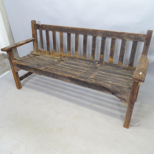 2672 - A vintage stained teak slatted garden bench. 160cm x 84cm x 60cm