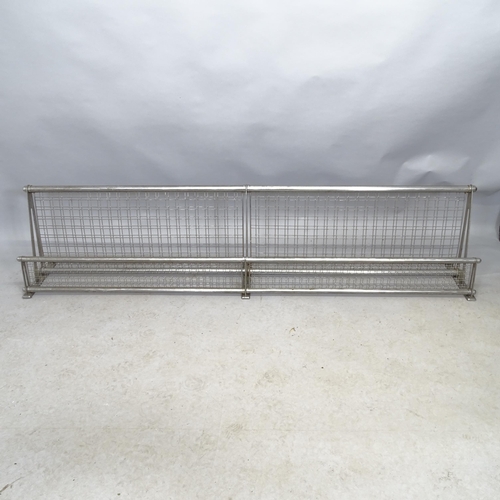 2676 - A vintage railway luggage rack. Length 188cm