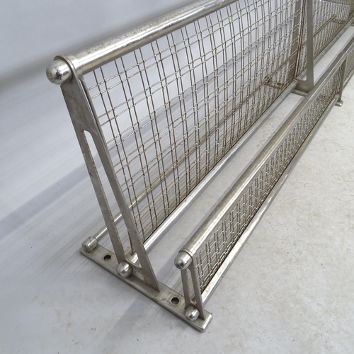 2676 - A vintage railway luggage rack. Length 188cm