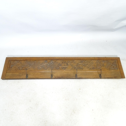 2678 - A carved oak Art Nouveau style hanging coat rack with 4 hooks, inscribed In Te Domine Confido. 153cm... 