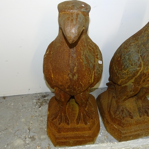 2684 - A pair of cast iron sculptures, studies of Eagles. Height 80cm.