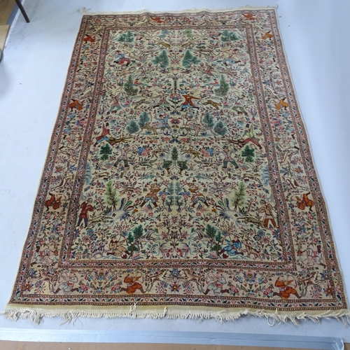 2341 - An Iranian cream-ground rug, the central lozenge and borders decorated with hunting scenes. 215cm x ... 