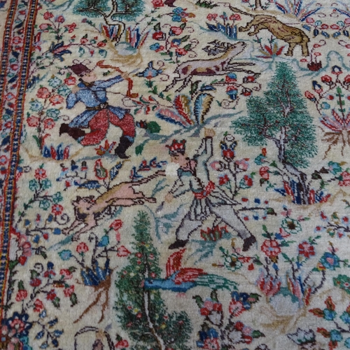 2341 - An Iranian cream-ground rug, the central lozenge and borders decorated with hunting scenes. 215cm x ... 