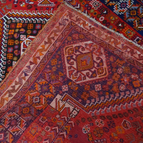 2344 - A red-ground Hamadan carpet. 275cm x 180cm