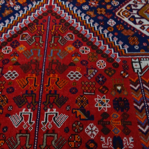 2344 - A red-ground Hamadan carpet. 275cm x 180cm