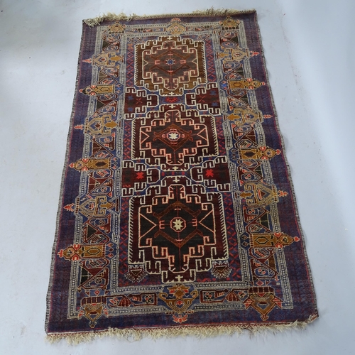 2346 - A red/brown ground Afghan Baluchi rug. 190cm x 115cm