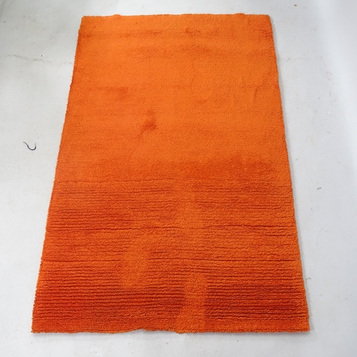 2350 - A mid-century orange ground rug, 190 x 115cm.