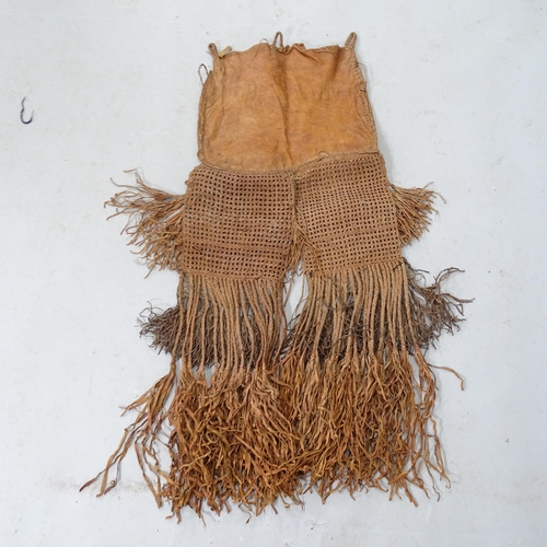 799 - A pair of leather fringed chaps. L - 110cm.