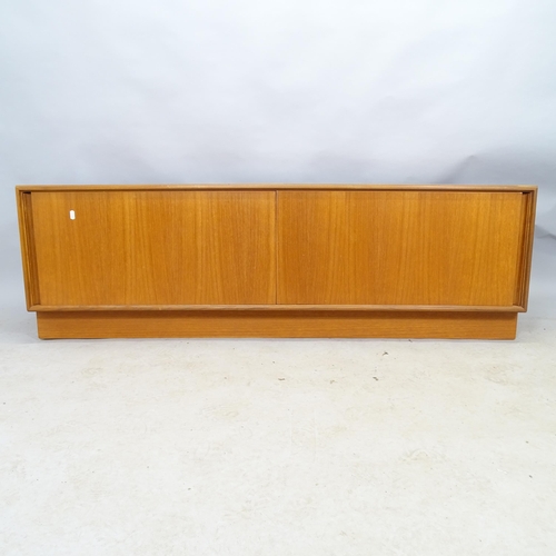 2510 - A mid-century G-plan teak low sideboard with two sliding doors. 153cm x 49cm x 46cm