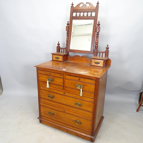 2595 - An Arts and Crafts oak dressing chest with raised back containing two fitted drawers, the chest havi... 