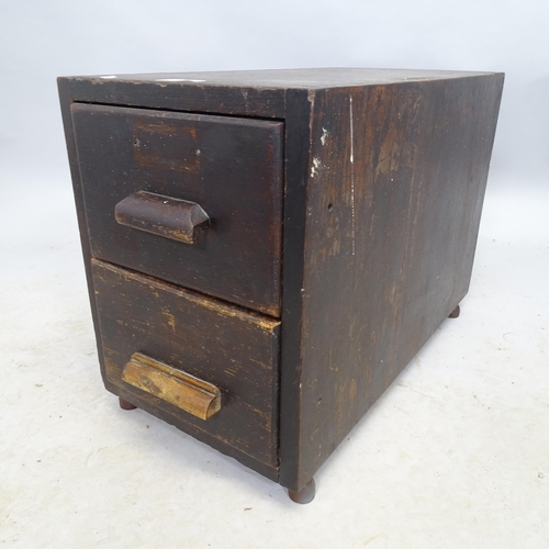 2713 - A Vintage stained pine filng chest of two drawers. 28cm x 38cm x 56cm