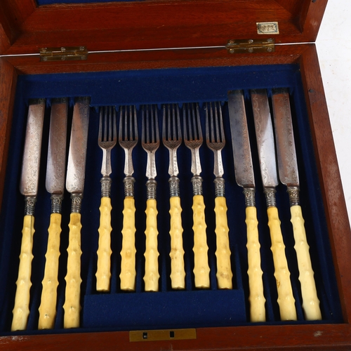 904 - An early 20th century set of dessert knives and forks for 12 people, with engraved blades, in fitted... 