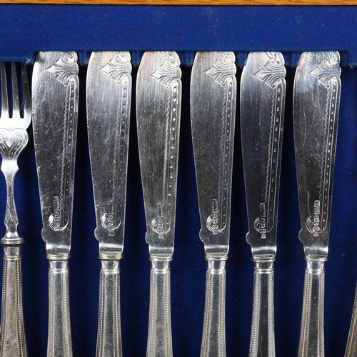 906 - MAPPIN & WEBB - an early 20th century silver plated canteen of fish cutlery for 12 people, in origin... 