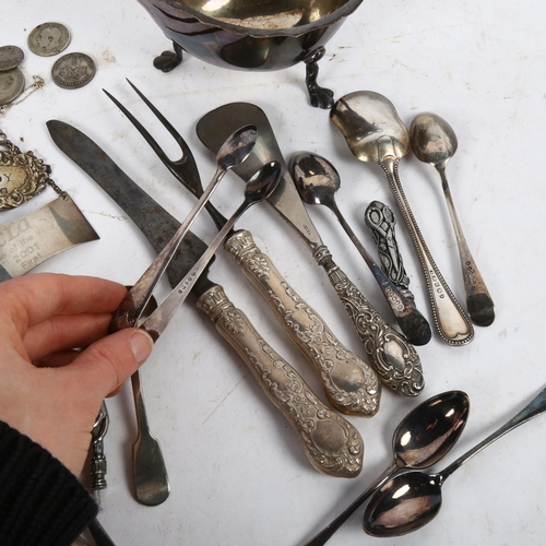 920 - A silver Brandy decanter label, and another, a silver-handled shoe horn, and a pair of silver sugar ... 