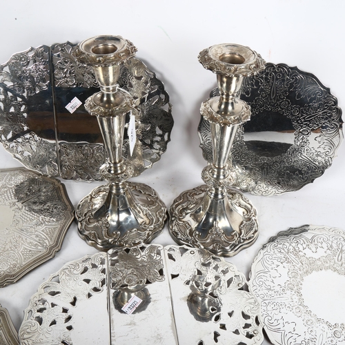 923 - A pair of silver plate on copper candlesticks, and a quantity of silver plated place mats, and 2 dis... 