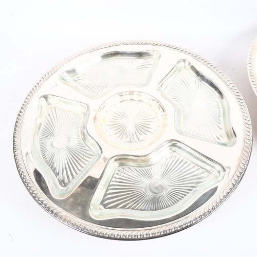 938 - A pair of silver plated lazy Susan's, with fitted glass dishes