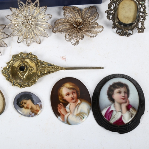 966 - 4 silver filigree brooches, a miniature Chinese white metal frame, 3 painted ceramic panels etc