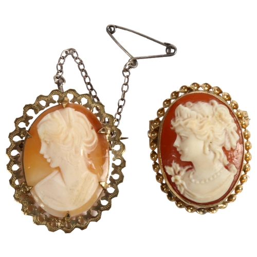 971 - 2 relief carved cameos, in scrolled and pierced 9ct gold mounts