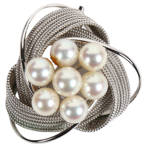 973 - A stylised woven and scrolled pearl set silver pendant/brooch, width 40mm