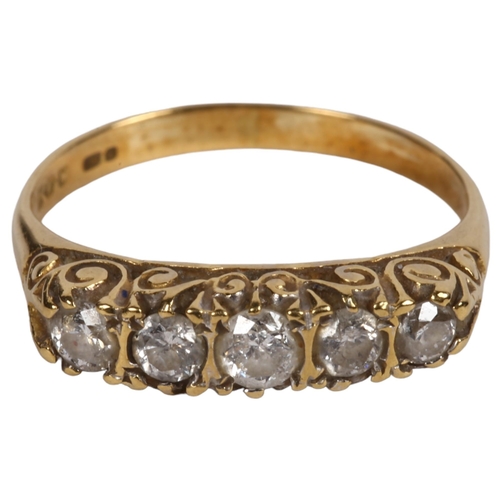 974 - An 18ct gold ring, set with a band of 5 diamonds, size M