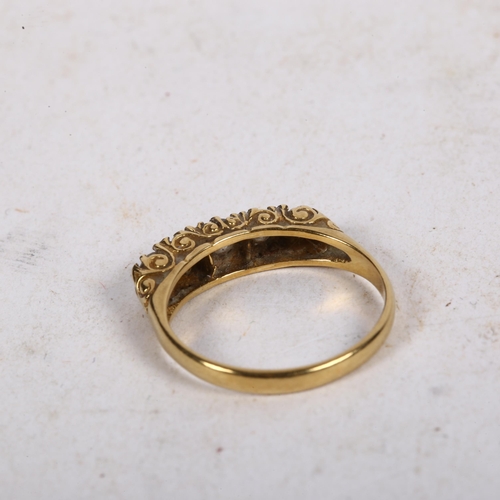 974 - An 18ct gold ring, set with a band of 5 diamonds, size M