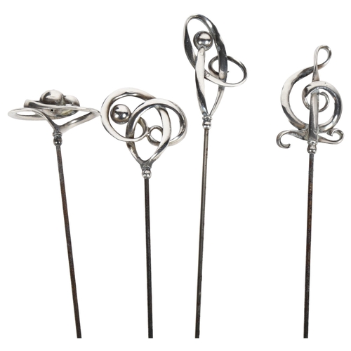 984 - A group of 4 Charles Horner stylised silver-topped hat pins