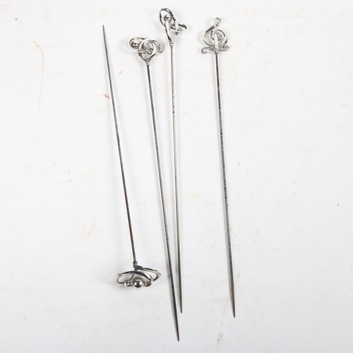 984 - A group of 4 Charles Horner stylised silver-topped hat pins